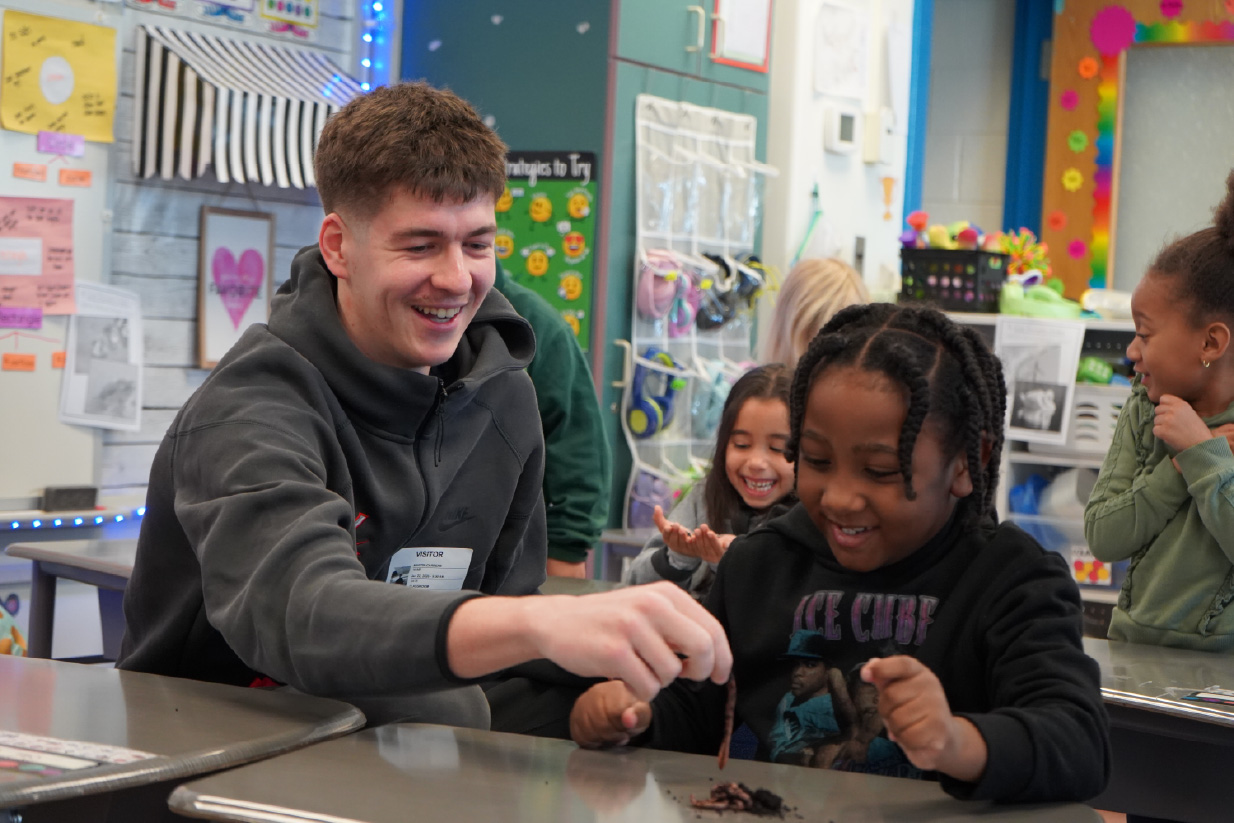Student Athletes engaging with local youth in community service